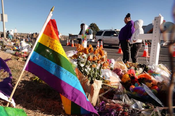 PHOTO: People visit a memorial near the Club Q nightclub, Nov. 22, 2022, in Colorado Springs, Colo. (Scott Olson/Getty Images)