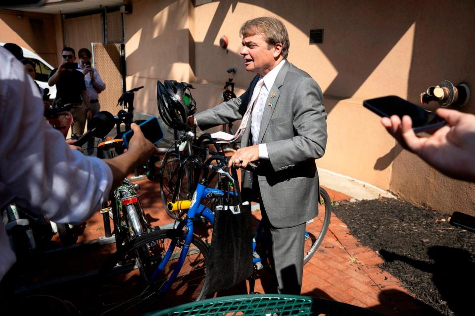 PHOTO: Rep. Mike Quigley speaks with reporters while getting on a bicycle as he departs a House Democratic Caucus meeting at Democratic National Committee headquarters, on Capitol Hill, on July 9, 2024. (Francis Chung/Politico via AP)