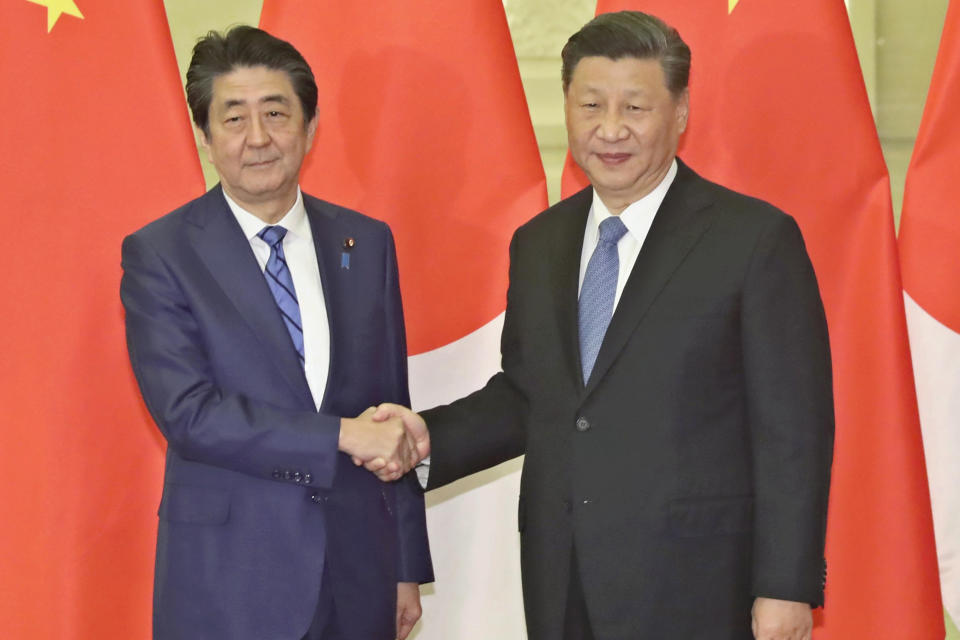 Japan’s late Prime Minister Shinzo Abe with Chinese President Xi Jinping in Beijing in 2019. (Koki Kataoka / AP file)