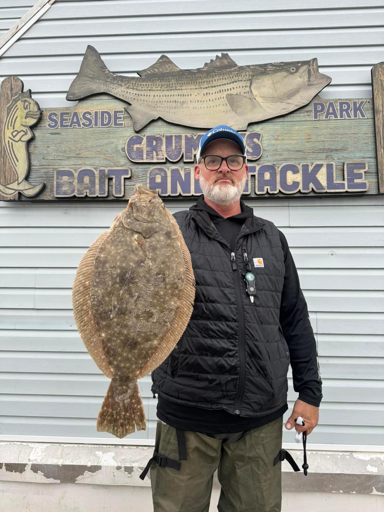 Tom Yensel holds a 3.3-pound fluke he caught in the Ocean County surf on Saturday, May 4, the opening day of the 2024 fluke season.