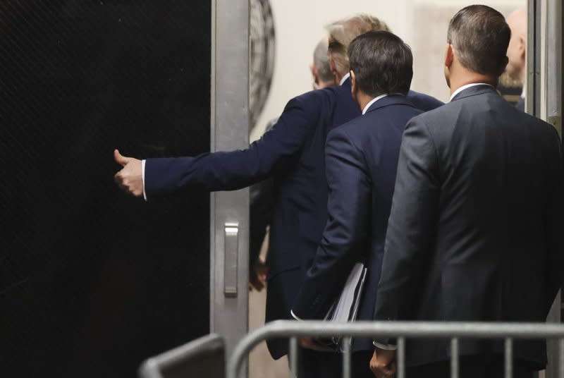 Former President Donald Trump gestures as he leaves the courtroom for a recess during his criminal trial at Manhattan criminal court in New York on Thursday. Pool Photo by Brendan McDermid/UPI
