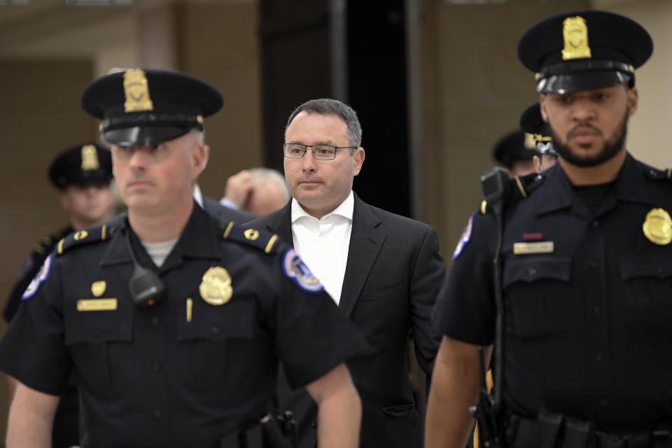 Former National Security Council Director for European Affairs Lt. Col. Alexander Vindman, center, leaves after reviewing his testimony in a closed-door interview on Capitol Hill in Washington, Thursday, Nov. 7, 2019, in the impeachment inquiry on President Donald Trump's efforts to press Ukraine to investigate his political rival, Joe Biden. (AP Photo/Susan Walsh)