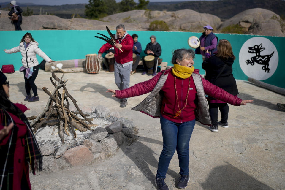 Monica Marracino dances in a spiritual ceremony near the Uritorco hill in Capilla del Monte, Cordoba, Argentina, Tuesday, July 18, 2023. In the pope’s homeland of Argentina, Catholics have been renouncing the faith and joining the growing ranks of the religiously unaffiliated. Commonly known as the “nones,” they describe themselves as atheists, agnostics, spiritual but not religious, or simply: “nothing in particular.” (AP Photo/Natacha Pisarenko)