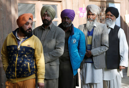 Members of Sikh minority line up to cast their votes during a parliamentary election at a polling station in Kabul, Afghanistan, October 20, 2018. REUTERS/Omar Sobhani