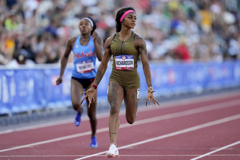 Sha'Carri Richardson wins a heat women's 100-meter run during the U.S. Track and Field Olympic Team Trials Friday, June 21, 2024, in Eugene, Ore. (AP Photo/Charlie Neibergall)