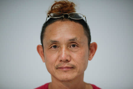 The academic advisor of the OPEN international performance art festival Cai Qing poses for a portrait during the event in the Songzhuang art colony outside Beijing, China, September 22, 2017. REUTERS/Thomas Peter