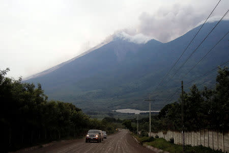 The road in front of Fuego volcano is seen covered with ash after the volcano erupted violently, in San Juan Alotenango, Guatemala June 3, 2018. REUTERS/Luis Echeverria