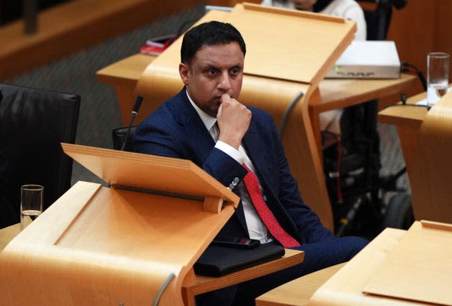 Anas Sarwar seated at desk in Holyrood debating chamber