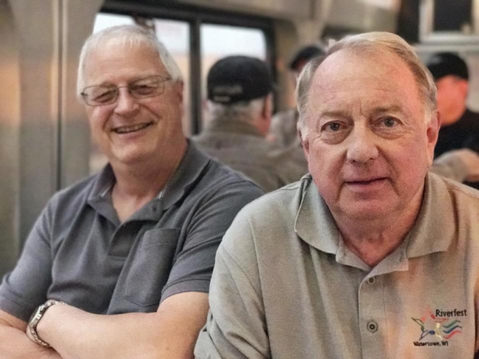 In this photo taken Tuesday, Jan. 24, 2017 photo, Tom Schultz, 68, and Joe Krueger, 60, of Watertown, Wisconsin, talk about their love of trains since boyhood along the rails. AP Tampa correspondent Tamara Lush spent 15 days traveling via train across the U.S. as part of Amtrak's residency program, designed for creative professionals to spend time writing on the rails. She spoke with dozens of people _ fellow travelers, friends and family waiting for loved one at stations, train workers _ and filed occasional dispatches for the Tales on a Train project. (AP Photo/Tamara Lush)