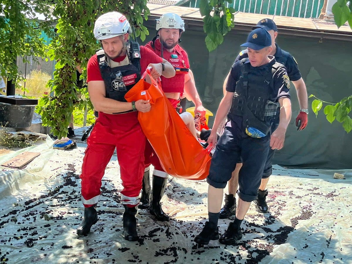 Rescue workers in the Kherson region carry out an evacuation (State Emergency Service of Ukraine/EPA)