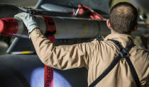 <p>In this image released by Britain’s Ministry of Defense, a Tornado pilot checks the weapons on his Tornado at Britain Royal Air Force base in Akrotiri, Cyprus, after its mission to conduct strikes in support of operations over the Middle East Saturday, April 14, 2018. (Photo: Cpl L Matthews/MoD via AP) </p>