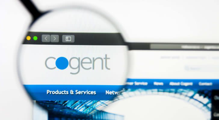 A  photo of the  cogent logo inside a magnifying glass