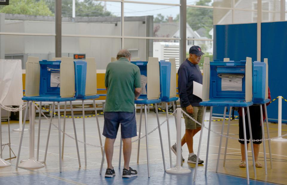 Voters mark their choices on ballots Tuesday morning at the Chatham Community Center. Chatham Town Clerk Julie Smith said the polls were slow Tuesday morning. To see more photos, go to www.capecodtimes.com/news/photo-galleries.