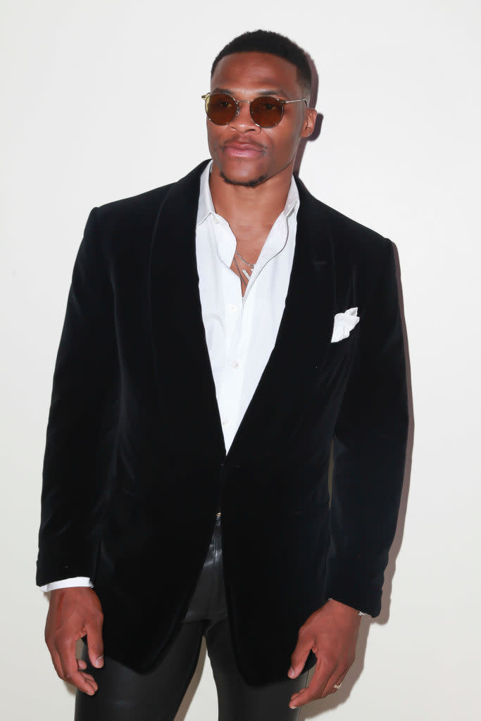 <p>Russell Westbrook attends Tom Ford’s spring/summer 2019 fashion show wearing a black velvet cocktail jacket and classic white shirt on Sept. 5, 2018, in New York City. (Photo: Amber De Vos/Patrick McMullan via Getty Images) </p>