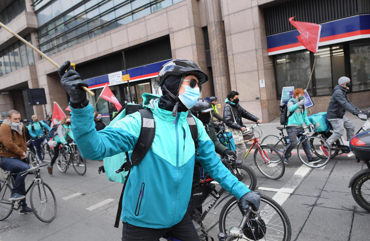 Deliveroo riders from the Independent Workers' Union of Great Britain (IWGB) in the City of London, as they go on strike in a dispute for fair pay, safety protections and basic workers' rights. Picture date: Wednesday April 7, 2021.