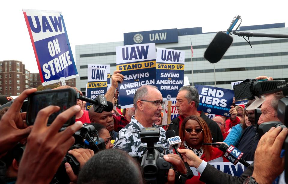 UAW president Shawn Fain talks with the media after his speech to striking workers from the bed of a Ford F-150 at the UAW Solidarity House on Jefferson Avenue in Detroit on Friday, Sept. 29, 2023. Many of the workers caravanned in Ford Broncos and Jeeps to hear him speak.