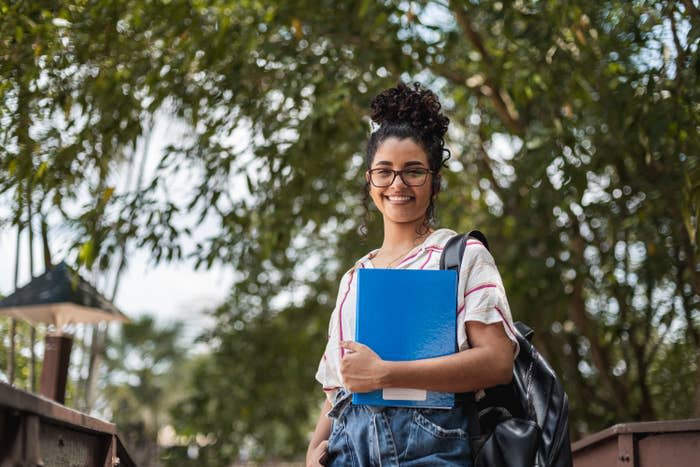 Female college student with a folder and a backpack