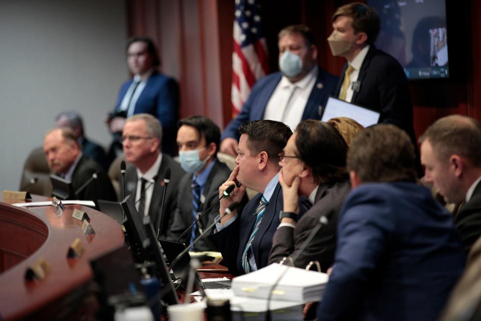 South Dakota lawmakers, including House Speaker Spencer Gosch, center, question law enforcement officers who investigated South Dakota Attorney General Jason Ravnsborg for a fatal car crash in 2020 during a House impeachment investigative committee meeting in Pierre, S.D., on Tuesday, Jan. 18, 2022. Lawmakers are weighing whether Ravnsborg should face impeachment charges. (AP Photo/Stephen Groves)