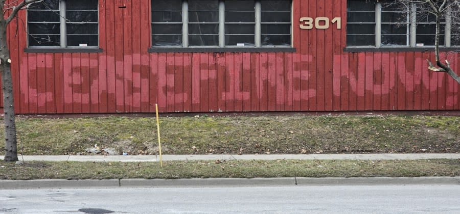 Graffiti painted on the Kent County Democratic Party building on Fuller Avenue NE on Feb. 13, 2024.