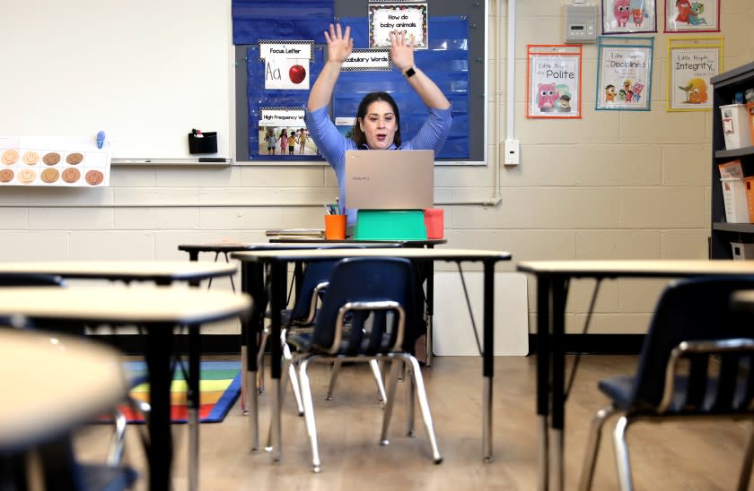 LA PUENTE-CA-SEPTEMBER 21, 2020: Kindergarten teacher Diana Torres gives live instruction to her students on her computer from her empty classroom at St. Joseph Catholic Elementary School in La Puente on Monday, September 21, 2020. (Christina House / Los Angeles Times)