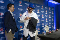 Carter Hawkins, Chicago Cubs general manager, left, talks with new shortstop Dansby Swanson after a baseball press conference Wednesday, Dec. 21, 2022, at Wrigley Field in Chicago. (Brian Cassella/Chicago Tribune)/