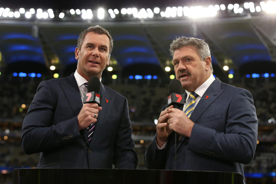 Wayne Carey and Brian Taylor, pictured here in action for Channel 7 before an AFL game in 2019.