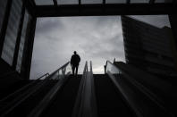 A person enters the public transport station Potsdamer Platz in Berlin, Germany, Tuesday, Nov. 30, 2021. According to local authorities wearing face masks is mandatory in public transport and passengers need to be vaccinated, recovered or tested negative of the coronavirus. (AP Photo/Markus Schreiber)