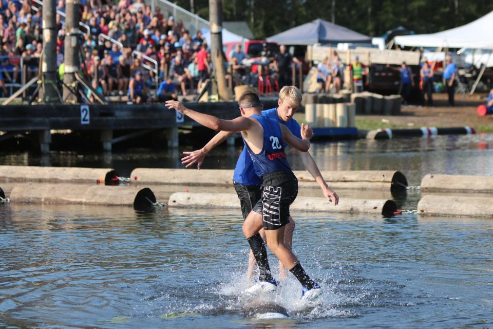 Tanner Hallett (facing camera) and Anthony Polentini fac eoff in the men's pro division final at the Lumberjack World Championships in Hayward.