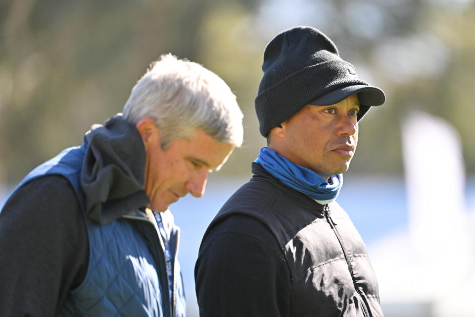 Tiger Woods and Jay Monahan
