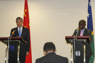 China's Foreign Minister Wang Yi, left, and his counterpart from the Solomon Islands, Jeremiah Manele hold a joint press conference in Honiara, Solomon Islands, early Thursday, May 26, 2022. Wang and a 20-strong delegation have arrived in the Solomon Islands at the start of an eight-nation Pacific tour that comes amid growing concerns about Beijing's military and financial ambitions in the region. (AP Photo)