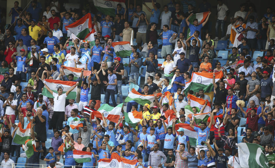 Indian fans celebrate the dismissal of a Pakistani batsman during the one day international cricket match of Asia Cup between India and Pakistan in Dubai, United Arab Emirates, Wednesday, Sept. 19, 2018. (AP Photo/Aijaz Rahi)