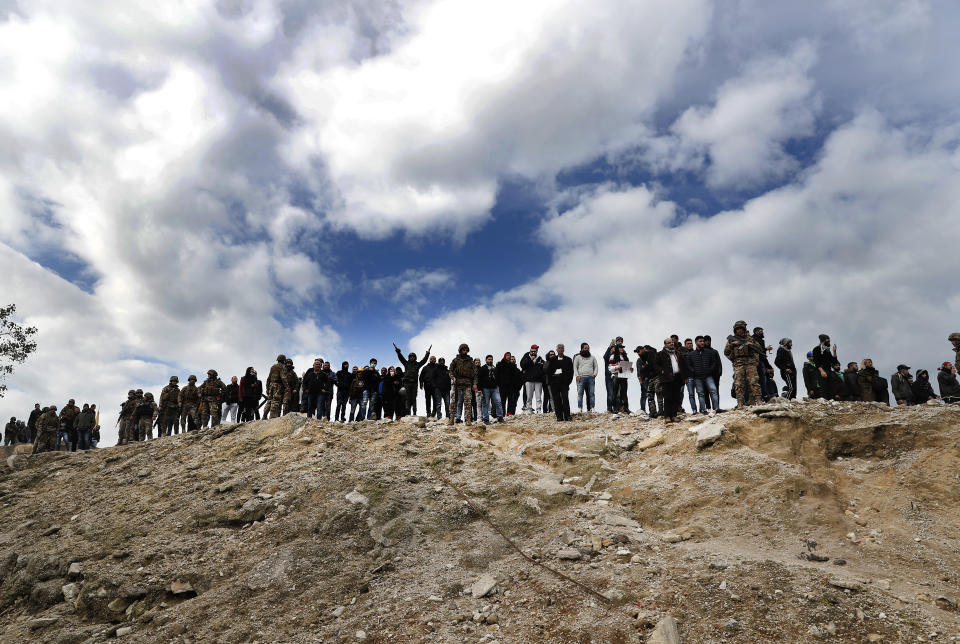 Army soldiers stand guard during a protest against the new government in downtown Beirut, Lebanon,Tuesday, Feb. 11, 2020. Clashes broke out Tuesday between Lebanese protesters and security forces near the parliament building in central Beirut, where the new Cabinet is scheduled to submit its policy statement ahead of a vote of confidence. (AP Photo/Hussein Malla)