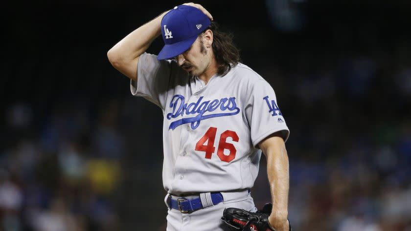 Los Angeles Dodgers starting pitcher Tony Gonsolin pauses on the mound during the first inning of a baseball game against the Arizona Diamondbacks Wednesday, June 26, 2019, in Phoenix. (AP Photo/Ross D. Franklin)