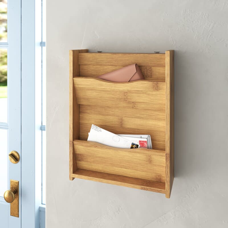 <p><a href="https://go.redirectingat.com?id=74968X1596630&url=https%3A%2F%2Fwww.wayfair.com%2Fstorage-organization%2Fpdp%2Ffoundstone-laurie-bamboo-wall-mail-organizer-with-key-hooks-w004042554.html&sref=https%3A%2F%2Fwww.cosmopolitan.com%2Flifestyle%2Fg38283695%2Fdesk-organization-ideas%2F" rel="nofollow noopener" target="_blank" data-ylk="slk:Shop Now;elm:context_link;itc:0;sec:content-canvas" class="link ">Shop Now</a></p><p>Millwood Pines Darley Bamboo Wall Mail Organizer</p><p>wayfair.com</p><p>$41.99</p><span class="copyright">Wayfair</span>