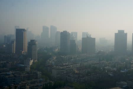 Buildings are seen during a moderately polluted day in Nanjing, Jiangsu Province, China, April 19, 2016. Picture taken April 19, 2016. REUTERS/Stringer/File Photo