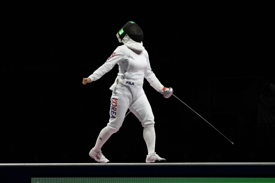 Kang Young Mi of South Korea celebrates winning a point as competes with Katrina Lehis of Estonia in the women's individual Epee team final competition at the 2020 Summer Olympics, Tuesday, July 27, 2021, in Chiba, Japan. (AP Photo/Hassan Ammar)