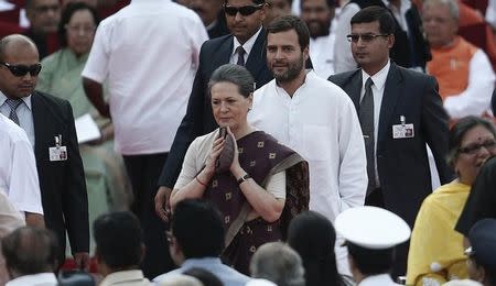 India's Congress party chief Sonia Gandhi (C) and her son and lawmaker Rahul Gandhi (2nd R) arrive to attend Prime Minister Narendra Modi's oath-taking ceremony at the presidential palace in New Delhi May 26, 2014. REUTERS/Adnan Abidi
