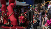 Hundreds of thousands of people lined canals in the Dutch capital to watch the colorful spectacle of the Pride Canal Parade return for the 25th edition after the last two events were canceled due to the COVID-19 pandemic, in Amsterdam, Netherlands, Saturday, Aug. 6, 2022. (AP Photo/Peter Dejong)