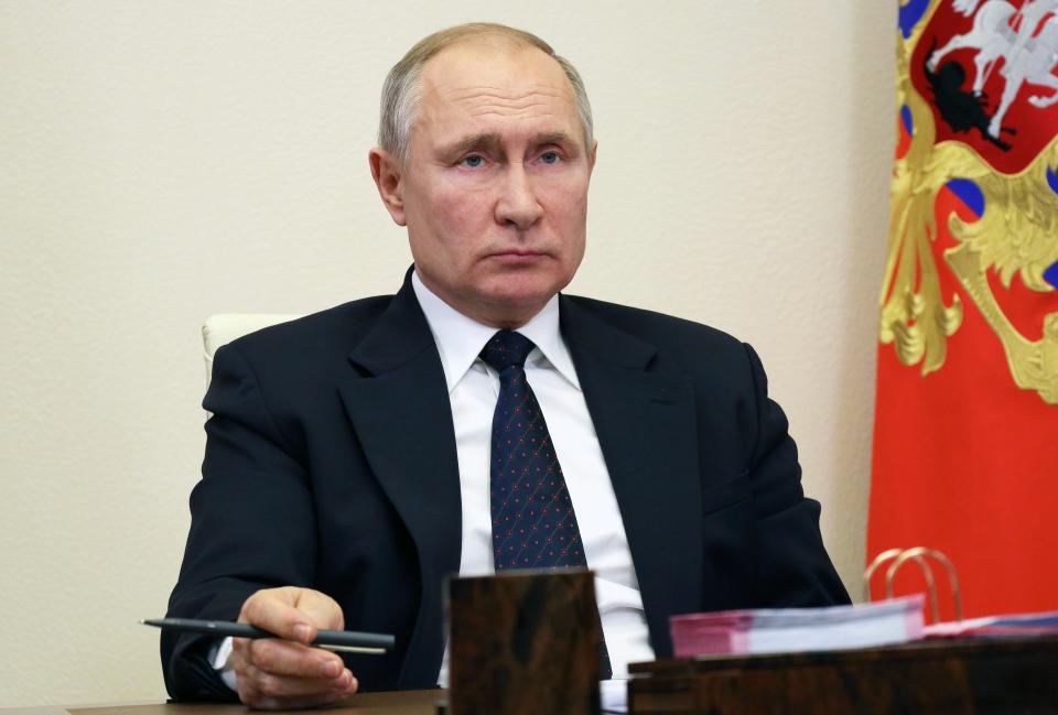 Russian President Vladimir Putin attends a meeting via video conference at his residence.