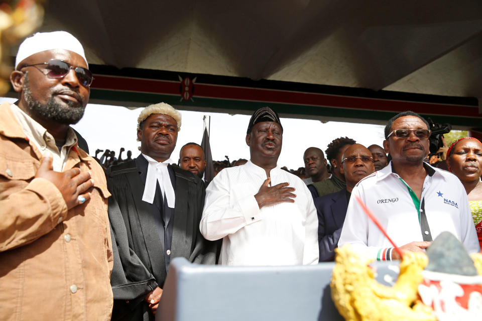 <p>Kenyan opposition leader Raila Odinga of the National Super Alliance (NASA) stands for the national anthem before taking a symbolic presidential oath of office in Nairobi, Kenya, Jan. 30, 2018. (Photo: Baz Ratner/Reuters) </p>