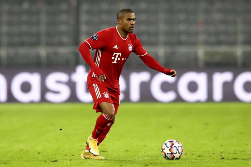 Bayern's Douglas Costa controls the ball during the Champions League group A soccer match.