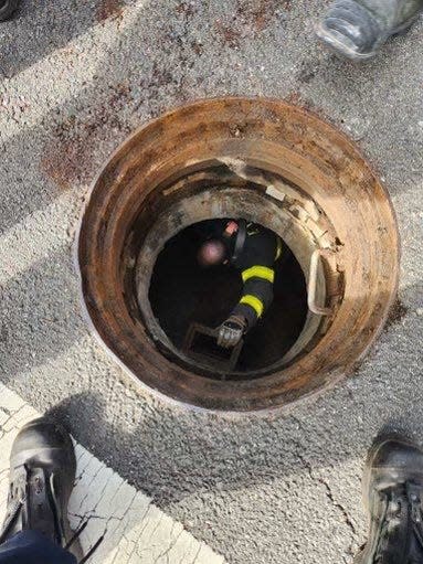 FDNY firefighter John Loennecker helped guide the lost children under the manhole.