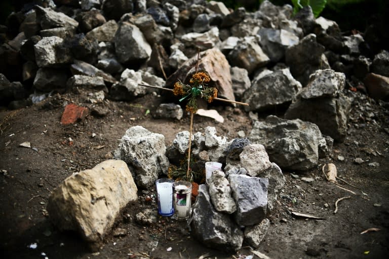 An altar positioned next to a wall which collapsed during the quake that rattled the Mexican capital and its surrounding area on September 19, in Xochimilco, Mexico City, on October 4, 2017