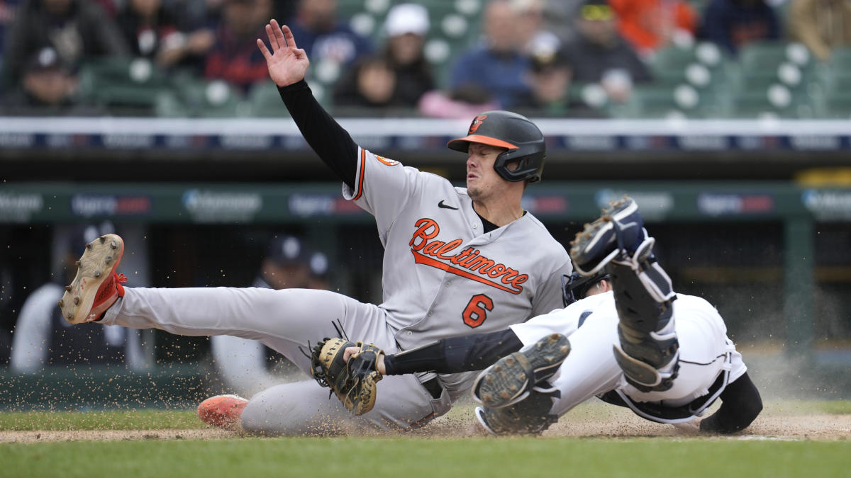 Adam Frazier of the Baltimore Orioles throws the ball to first