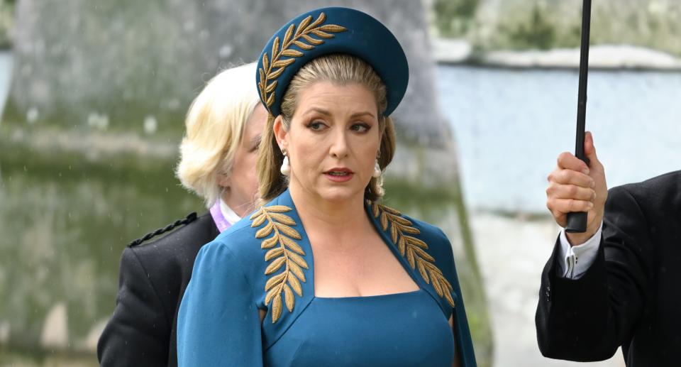 Penny Mordaunt wears teal and gold to the King's coronation.