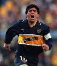 FILE - In this Oct. 25, 1997 file photo, Diego Armando Maradona celebrates a goal on his last official soccer game with Boca Juniors in Buenos Aires, Argentina.The Argentine soccer great who was among the best players ever and who led his country to the 1986 World Cup title before later struggling with cocaine use and obesity, died from a heart attack on Wednesday, Nov. 25, 2020, at his home in Buenos Aires. He was 60. (AP Photo/Eduardo Di Baia, File)