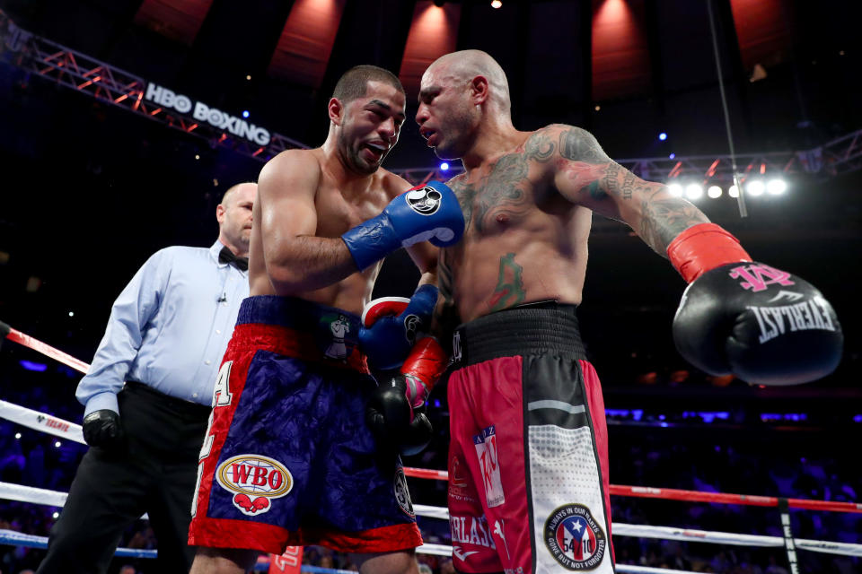 Sadam Ali (L) and Miguel Cotto embrace after Ali defeated Cotto by unanimous decision Saturday at Madison Square Garden in New York in what Cotto said was his final fight. (Getty)