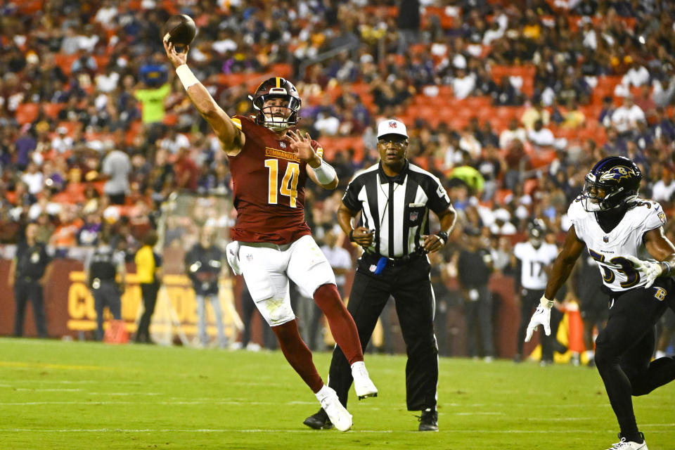 Washington Commanders quarterback Sam Howell (14) attempts a pass against the <a class="link " href="https://sports.yahoo.com/nfl/teams/baltimore/" data-i13n="sec:content-canvas;subsec:anchor_text;elm:context_link" data-ylk="slk:Baltimore Ravens;sec:content-canvas;subsec:anchor_text;elm:context_link;itc:0">Baltimore Ravens</a> during the first half at FedExField. Mandatory Credit: Brad Mills-USA TODAY Sports