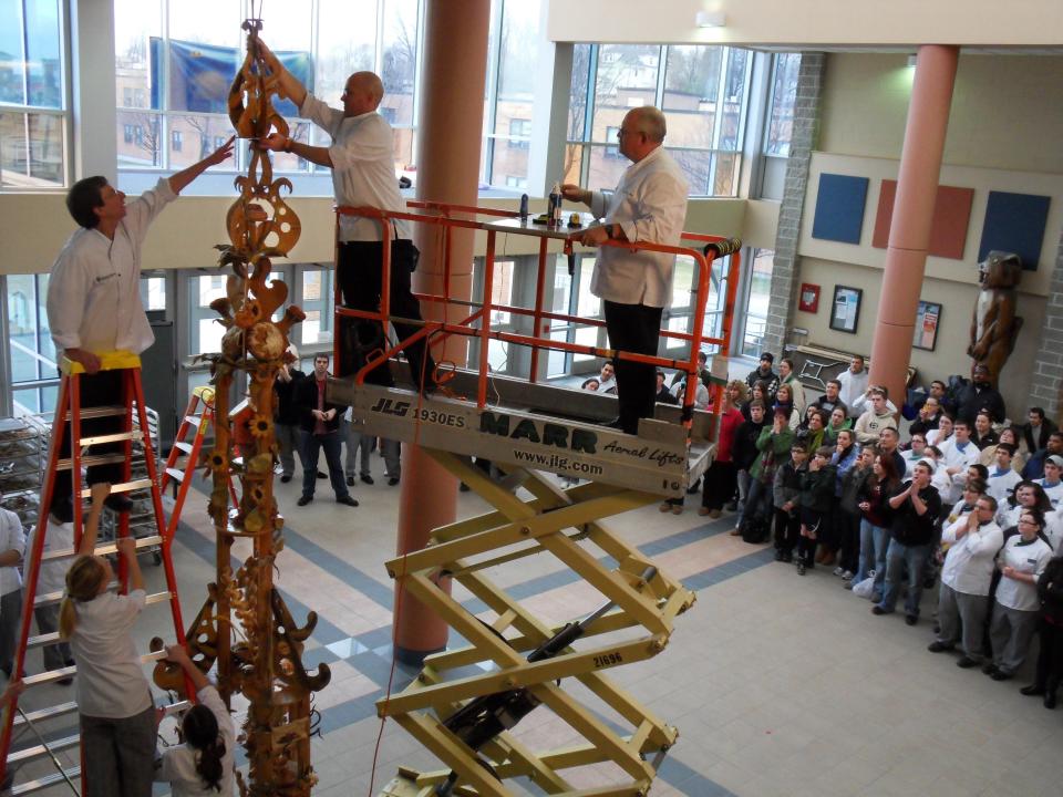 In 2008, professor and baker Ciril Hitz placed the top piece onto a record-making bread sculpture before a crowd of students at JWU.