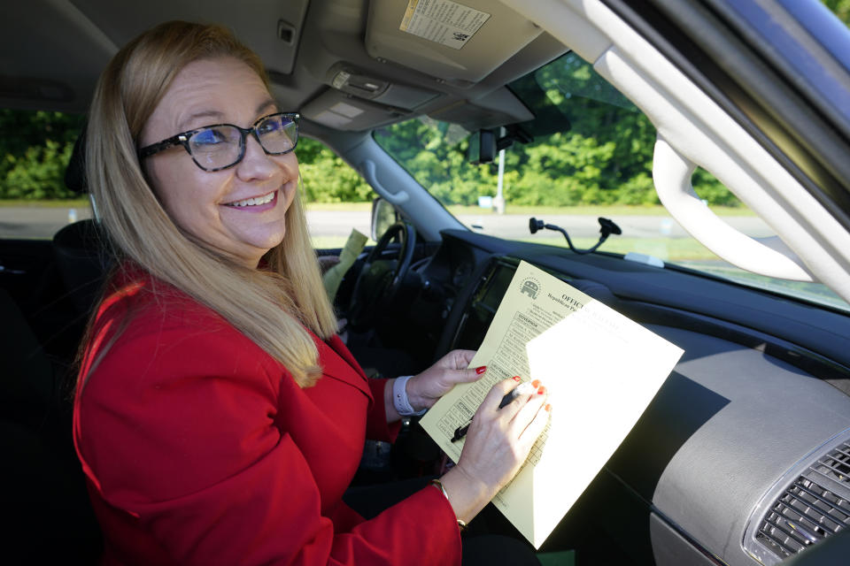 Republican gubernatorial candidate State Sen. Amanda Chase, fills out her ballot during a drive through GOP Convention vote in Chesterfield, Va., Saturday, May 8, 2021. (AP Photo/Steve Helber)